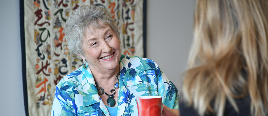 A woman talking to a counsellor.